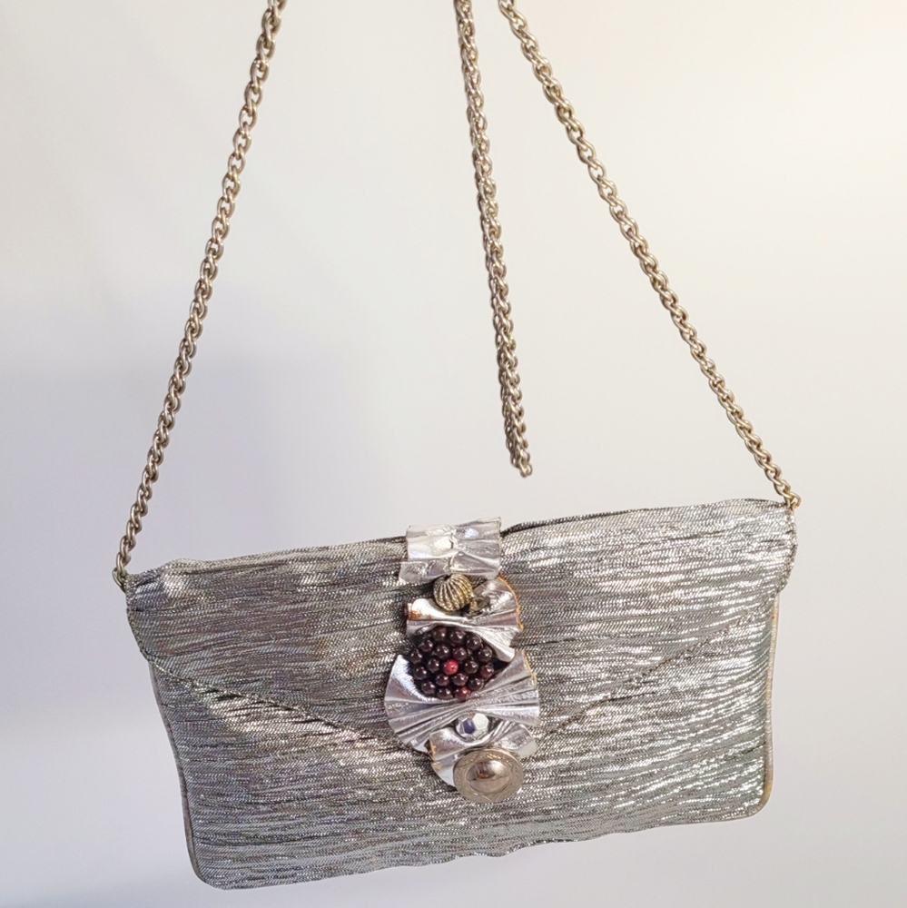 Rodo silver handbag/clutch with silver hardware and beads...size S/M